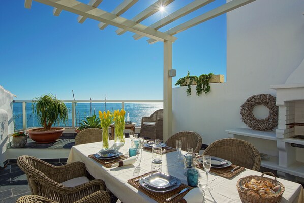 Terrace w/barbecue & al fresco dinning area oceanfront & lounge area.