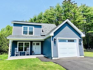 Front view of the cottage. Includes one car garage and private driveway.