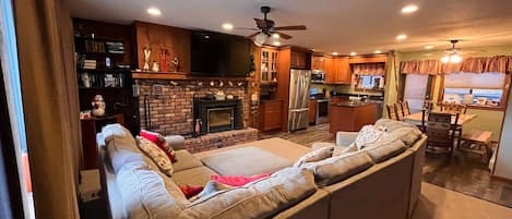 Full room scope of the open-floor layout between the living room and kitchen 