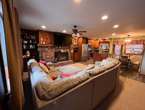 Full room scope of the open-floor layout between the living room and kitchen 