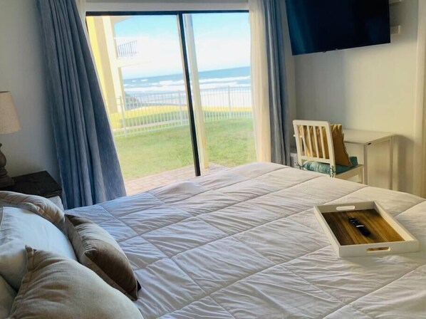 View of the ocean from the bed