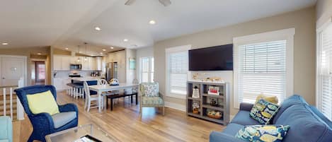 The open plan on the top floor with a vaulted ceiling provides great space for your entire group