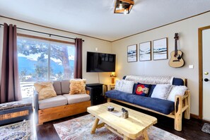 The cozy living room area perfect for doing work, talking,  playing games, or simply relaxing.