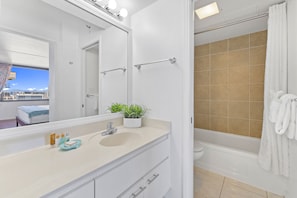 Full bathroom with tub and shower combo.