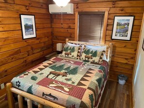 Lovely queen bedroom one with new memory foam mattress. USB outlets on the nightstands for charging while you recharge. Ceiling fan and closet.