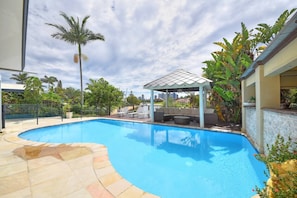 Beautiful big sparkling pool with outdoor lounge and Bar area