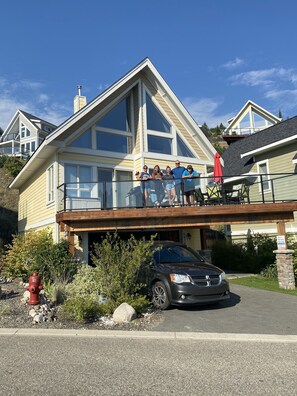 Another view of the cottage, with our family on the deck. Landscaping updated.