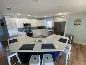 Open kitchen with huge island that seats 8!