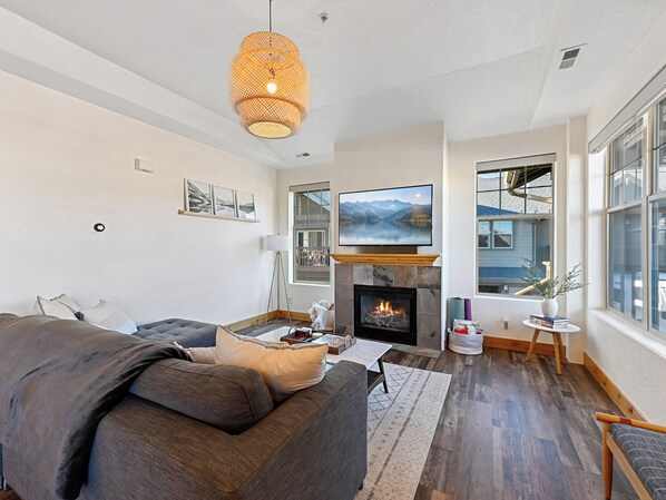 Cozy living area with gas fireplace and a 58" smart TV