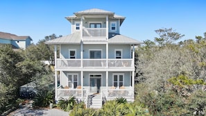 Porches! Three floors of outdoor space with a screened porch on the lower back.