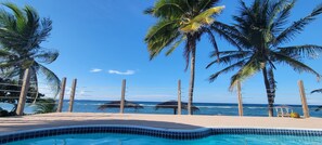 View from Master Bedroom across the pool deck and ocean