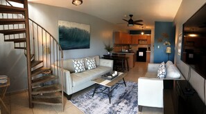 Living room and Kitchen. Stairs lead to the Terrace