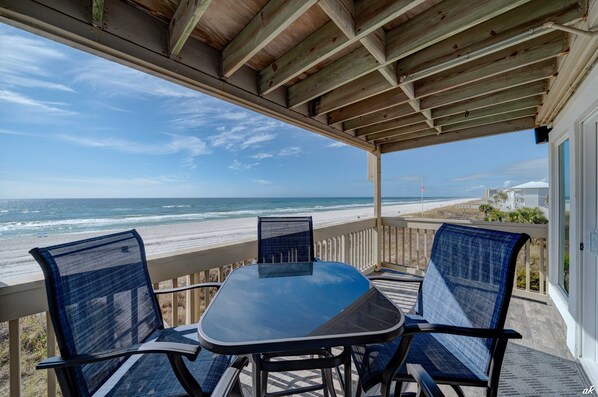 The balcony provides a breathtaking view of the Emerald Coast and the Gulf of Mexico, offering a serene escape.
