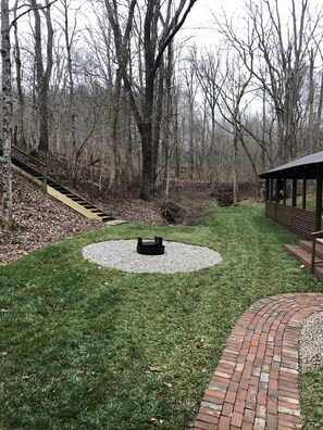 Fire ring with creek in the background 