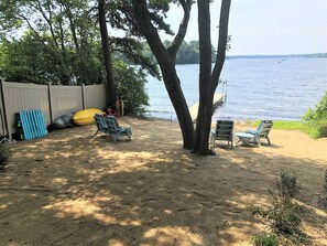 Private beach and dock in backyard overlooking Lake Wequaquet