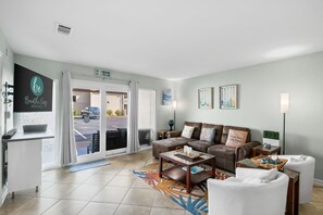 Welcome to Chateau LeMar. A pet friendly property. View of living room from the dining room and kitchen. Walk out to patio. Comfortable sofa with lounder at one end for a quick snooze.
