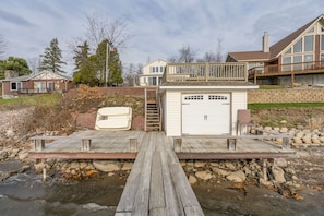 The house, elevated deck, and dock (paddle boat upside down)