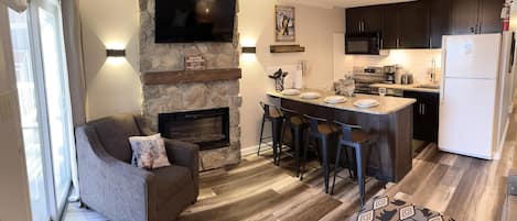 Welcome to Mountain Lodge 104, a renovated 2-bedroom village unit with a fireplace and great slopeside views.