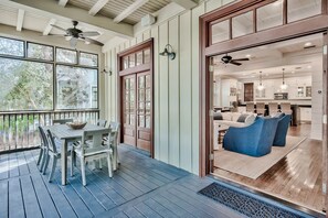Screened-in porch with outdoor dining