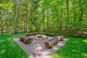 Great fire pit area with log seating