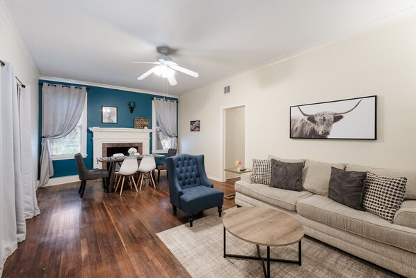Your complete living space: Smart TV, Comfy Couch, and Dining Table with 6 chair