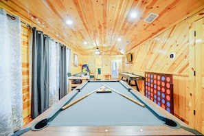 1 5 Ready to level up your vacation game? Come join the fun in our game room, where the competition is fierce and the naps are legendary!
