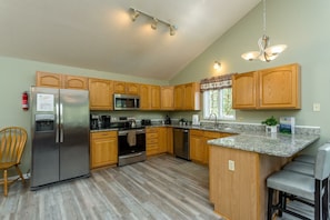 Well appointed kitchen with loads of space and a peninsula with seating