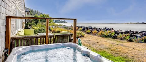 Soak your cares away with a view of the Alsea Bay.