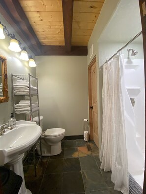 Remodeled main floor bathroom with new shower, toilet, & on demand HW tank 2022.