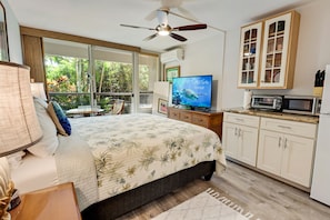 Relax and watch your favorite TV show on the comfortable California King bed.