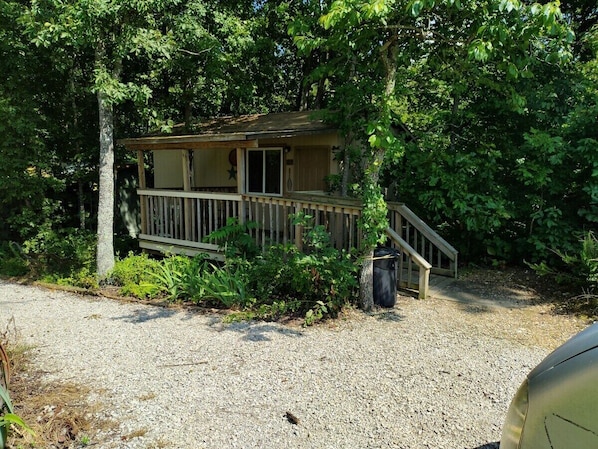 EXTERIOR:  The front of the cabin in the summer.  (Note the "Hillbilly-chic" styling. ;-)