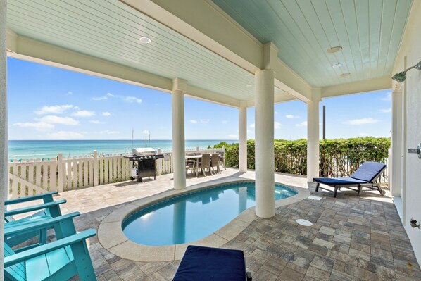 Pool and patio with gas grill and dining table for your convenience.