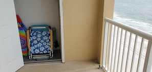 Storage closet w/ beach chairs, umbrellas, boogie boards, toys.