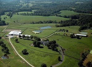 Overview of farm including stocked pond for fishing 