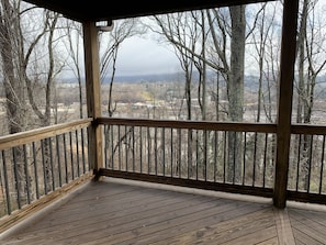 Main Level covered deck has views of the River Arts District and Downtown beyond