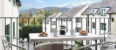 Enjoy breakfast or a glass of wine in the evening looking over the fells.