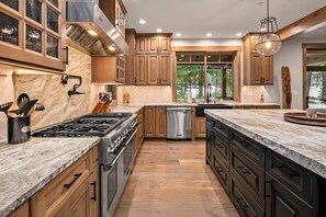 Dreamers Lodge: - Viking appliances throughout the kitchen featuring a 6 burner gas stove.