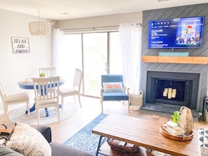 Bright and airy living room with modern coastal decor.  Make yourself at home!