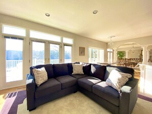 Wide open floorplan, wall of windows/french door facing the lake.