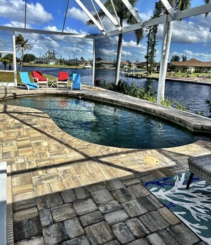 The pool and lanai overlook 2 canals. Relaxing and great for morning coffee! 