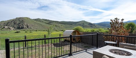 180 degree mountain view from our back deck, overlooks sauna and hot tub. 