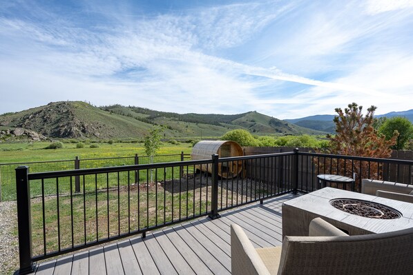 180 degree mountain view from our back deck, overlooks sauna and hot tub. 