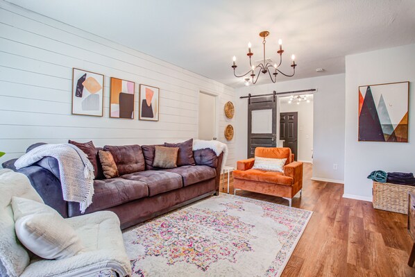 Cozy living room with a large sofa and 2 large chairs. Enjoy the Smart TV!