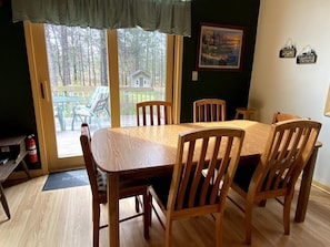 Dining is located right off of deck, accessible through patio door