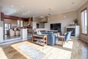 The open living room/kitchen floor plan allows for great family time. 