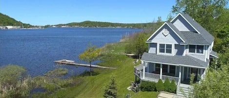 OVERALL:  A nice aerial view of the house with Betsie Lake right next to the house and downtown Frankfort and Lake Michigan in the distance.