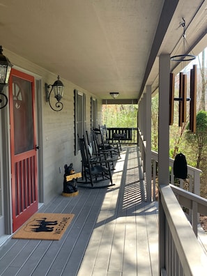 Enjoy rocking chairs and bench swing on the front porch