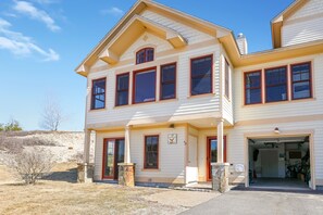 Outside view with a look at the one car garage. 