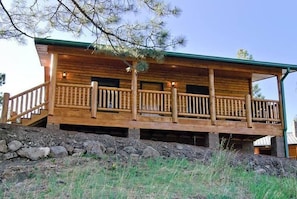 Our 2 bedroom, 2 bathroom log-sided cabin sits perched on the hillside above Little Colorado River.