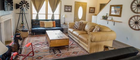 Spacious living room with queen sofa bed and 3 twin futons. Games & puzzles too!
